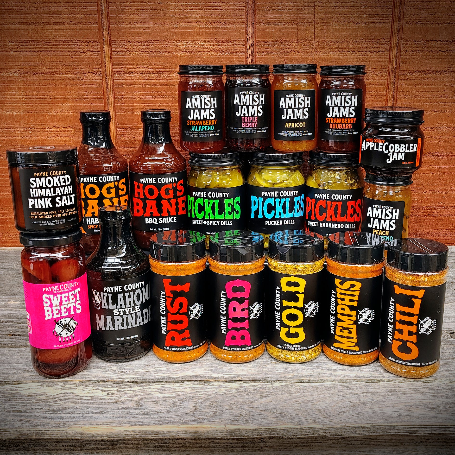 Bundle of Payne County Rust, Payne County Gold, Payne County Bird, Payne County Memphis, Payne County Chili, Payne County Hog's Bane BBQ Sauce, Payne County Hog's Bane Habanero BBQ Sauce, Payne County Oklahoma Style Marinade, Payne County Sweet Beets, Payne County Himalayan Smoked Salt, Payne County Amish Jams, Payne County Apple Cobbler Jam, and Payne County Pickles - Big Rock Foods